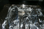 owinięte folią aluminiową cukinie- przed pieczeniem